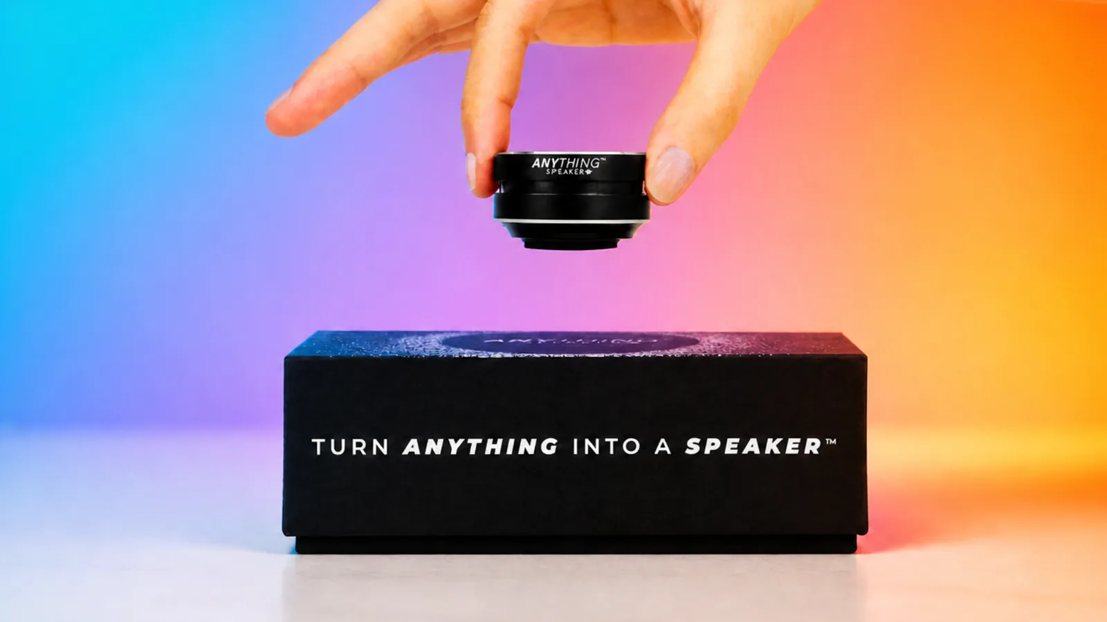 Anything Speaker next to its packaging and another speaker